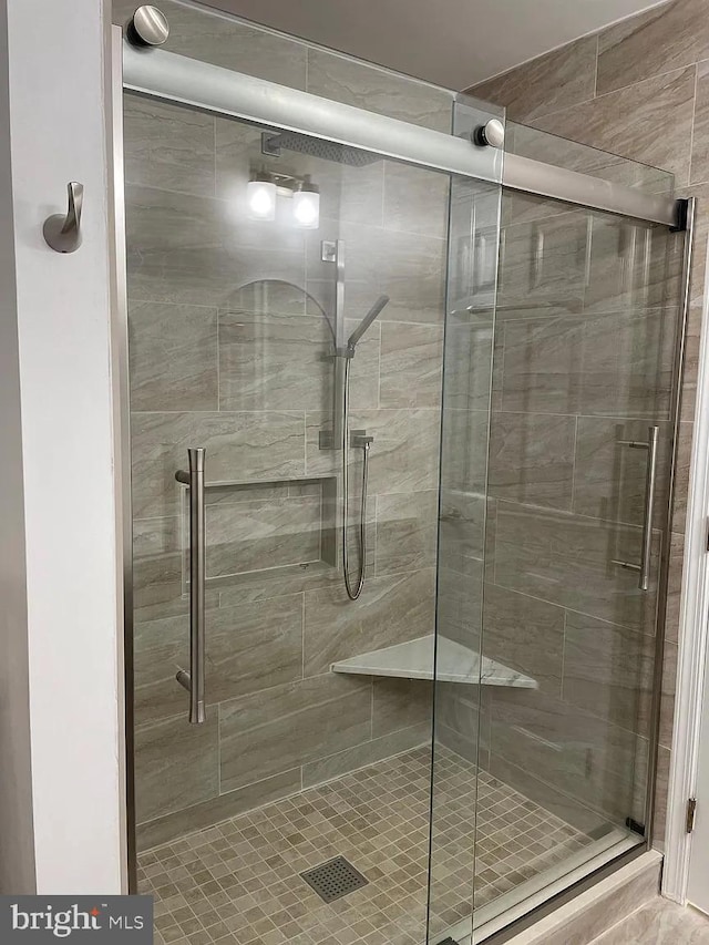 bathroom featuring a shower stall