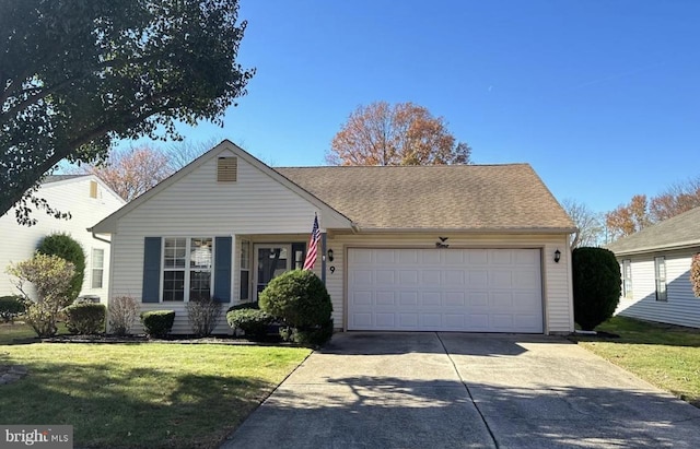 9 Fernwood Ct, Columbus, NJ 08022 - view of front of home featuring concrete driveway, an attached garage, and a front yard