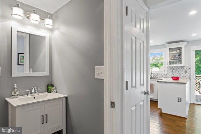 202 Trail Ct, Sterling, VA 20164 - bathroom featuring vanity, wood finished floors, backsplash, and recessed lighting