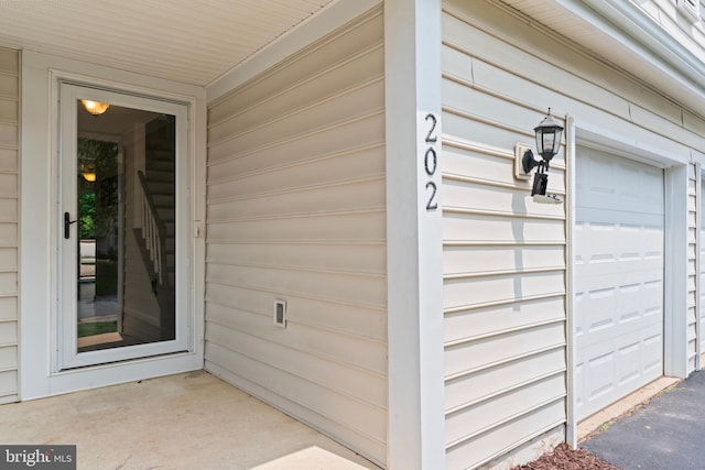 202 Trail Ct, Sterling, VA 20164 - doorway to property featuring a garage