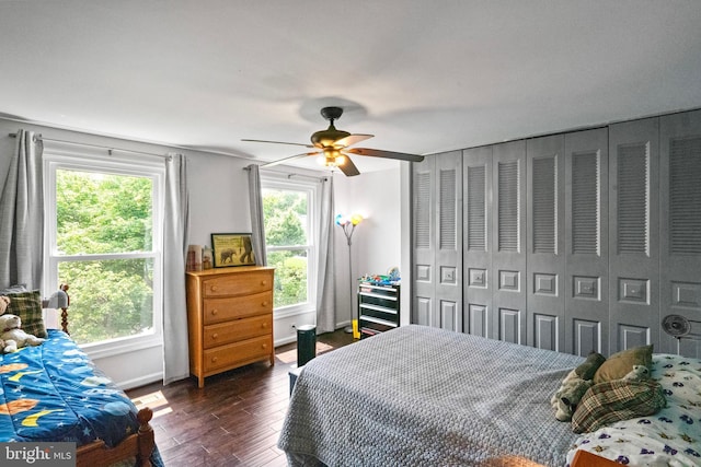 202 Trail Ct, Sterling, VA 20164 - bedroom with dark wood-style floors, a ceiling fan, and baseboards