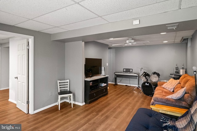 202 Trail Ct, Sterling, VA 20164 - living area featuring a drop ceiling, wood finished floors, baseboards, and a ceiling fan