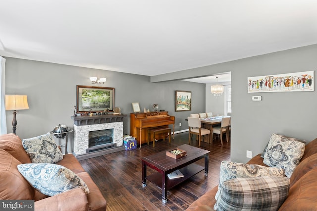 202 Trail Ct, Sterling, VA 20164 - living area featuring a chandelier, wood finished floors, and a stone fireplace