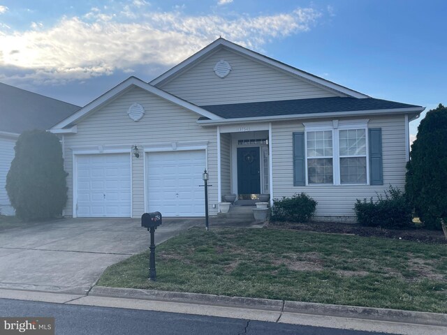 3754 China Grove Mews, Dumfries, VA 22025 - ranch-style house with concrete driveway, a garage, a front yard, and a shingled roof