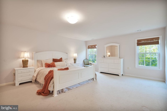 carpeted bedroom with baseboards