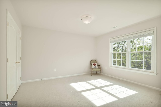 unfurnished bedroom featuring carpet flooring and baseboards