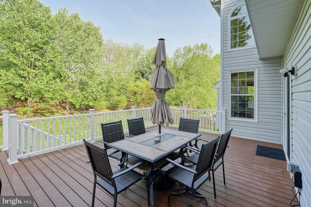 deck featuring outdoor dining area
