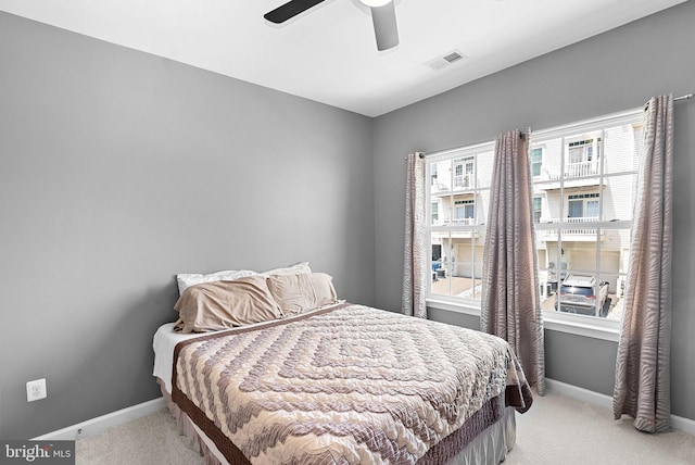 7471 Brunson Cir Unit 10A, Gainesville, VA 20155 - bedroom with light colored carpet and ceiling fan