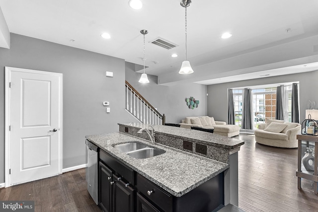 7471 Brunson Cir Unit 10A, Gainesville, VA 20155 - kitchen featuring dark cabinets, a kitchen island with sink, recessed lighting, dark wood finished floors, and decorative light fixtures