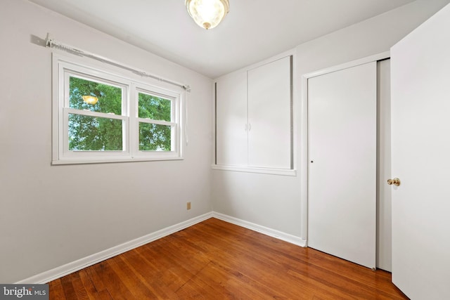 100 Furnlea Dr, Glen Burnie, MD 21060 - unfurnished bedroom featuring wood finished floors, baseboards, and a closet