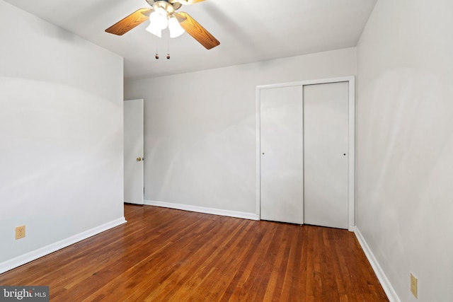 100 Furnlea Dr, Glen Burnie, MD 21060 - unfurnished bedroom featuring a closet, wood finished floors, baseboards, and ceiling fan