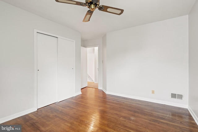 100 Furnlea Dr, Glen Burnie, MD 21060 - unfurnished bedroom featuring hardwood / wood-style flooring, baseboards, a closet, and a ceiling fan