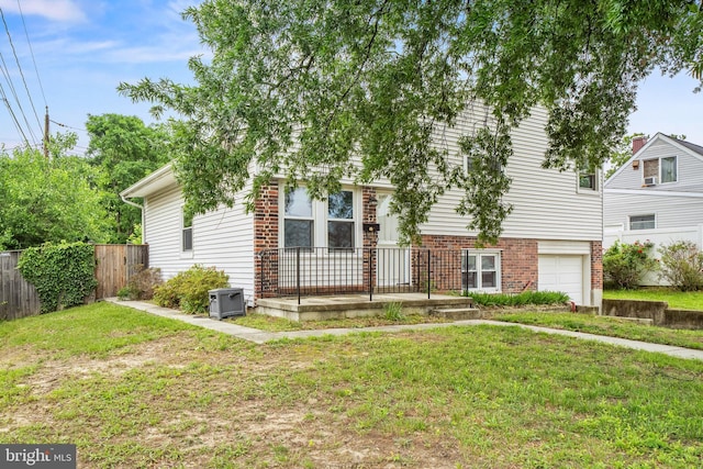 100 Furnlea Dr, Glen Burnie, MD 21060 - view of front facade with a garage and brick siding