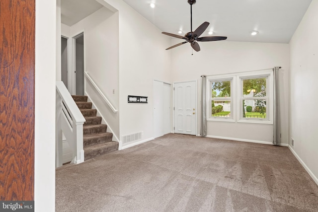 100 Furnlea Dr, Glen Burnie, MD 21060 - unfurnished living room with a ceiling fan, carpet flooring, stairs, baseboards, and vaulted ceiling