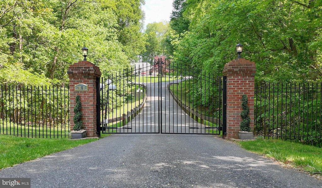 view of gate featuring fence