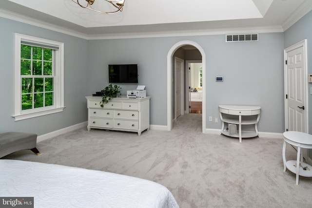 carpeted bedroom featuring baseboards, visible vents, a chandelier, crown molding, and arched walkways
