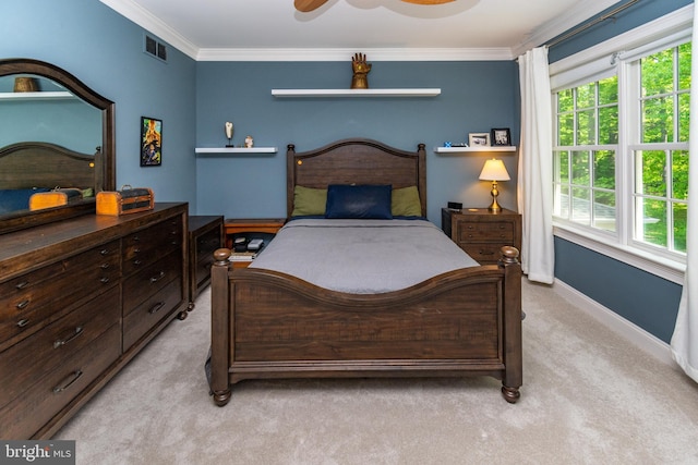 bedroom featuring visible vents, baseboards, ceiling fan, light colored carpet, and ornamental molding