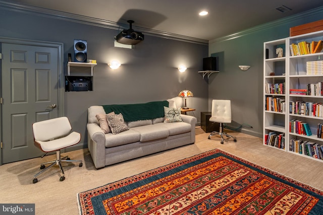 home theater room featuring baseboards, ornamental molding, and carpet floors