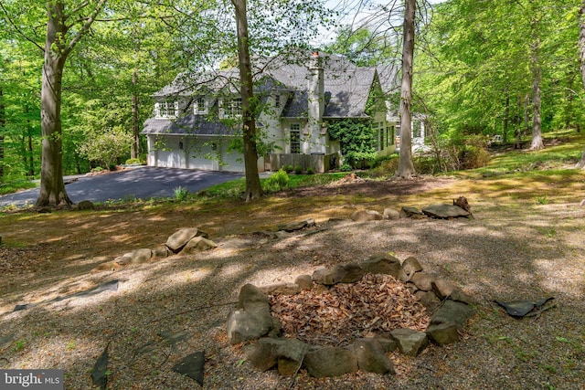 exterior space featuring aphalt driveway