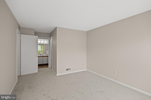135 Woodlake Dr, Marlton, NJ 08053 - carpeted spare room featuring baseboards and a sink