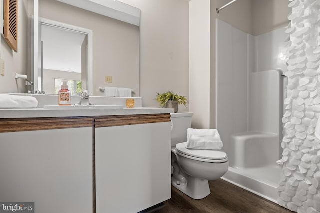 135 Woodlake Dr, Marlton, NJ 08053 - full bath with toilet, wood finished floors, and vanity