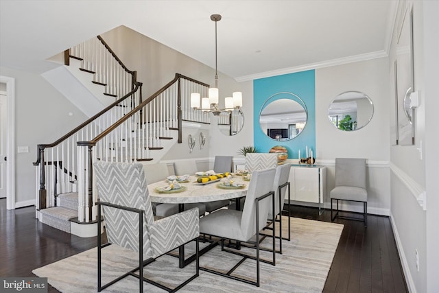 dining room featuring wood-type flooring, baseboards, stairway, and an inviting chandelier