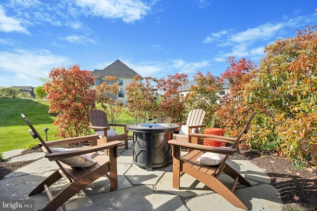 view of patio / terrace featuring an outdoor fire pit