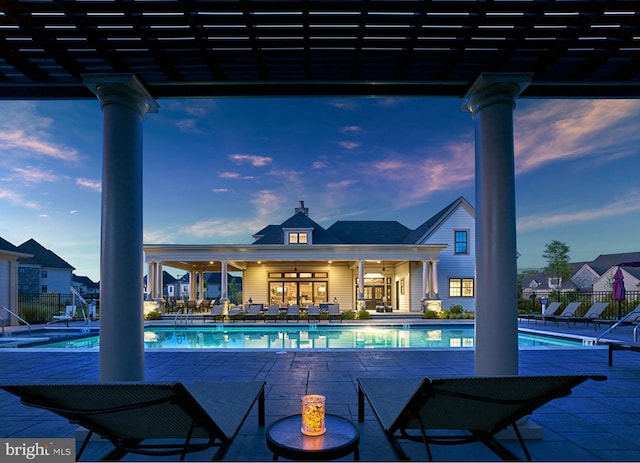 pool with fence and a patio area