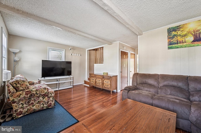 living room with a textured ceiling and wood finished floors