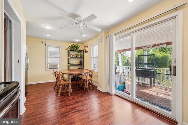 dining space featuring baseboards, a wealth of natural light, ceiling fan, and wood finished floors