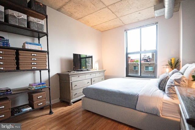bedroom with wood finished floors
