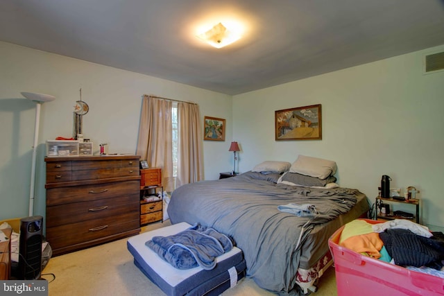bedroom with carpet flooring and visible vents