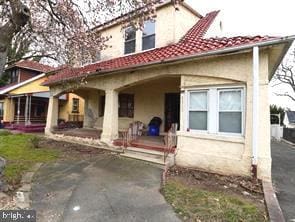 4815 E Roosevelt Blvd, Philadelphia, PA 19124 - back of house featuring a tile roof and stucco siding