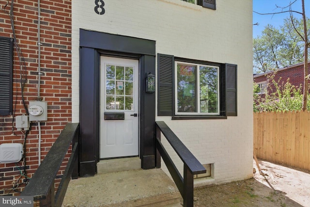 408 Fairview Ave, Lancaster, PA 17603 - doorway to property featuring brick siding and fence