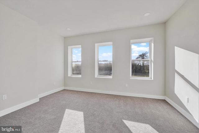 unfurnished room featuring baseboards, carpet flooring, and recessed lighting