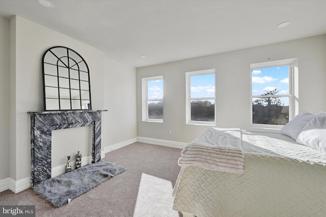 carpeted bedroom with recessed lighting and baseboards