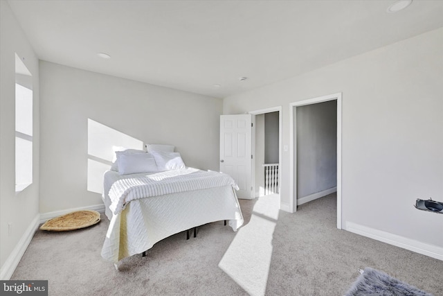 bedroom featuring recessed lighting, baseboards, and carpet