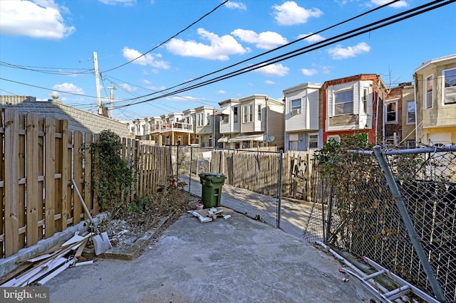 exterior space featuring a residential view and fence private yard
