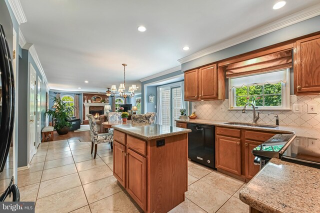 kitchen with decorative backsplash, a kitchen island, ornamental molding, black dishwasher, and light tile patterned flooring