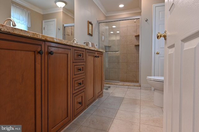 bathroom featuring vanity, ornamental molding, toilet, tile patterned floors, and a stall shower