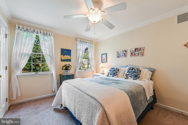bedroom with carpet floors, baseboards, visible vents, and crown molding