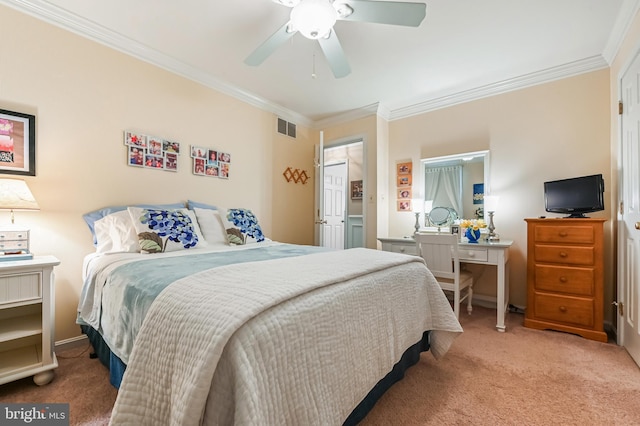 bedroom featuring carpet floors, ornamental molding, a ceiling fan, and visible vents