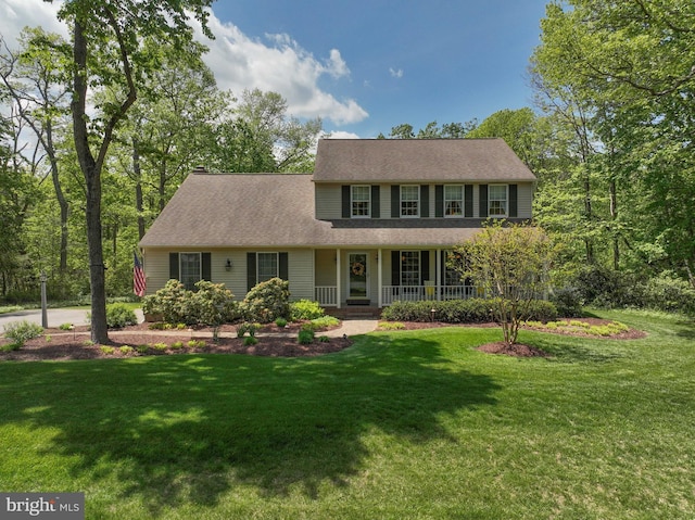 view of front of home featuring a porch and a front yard