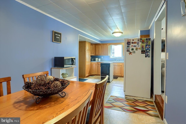 dining area featuring crown molding
