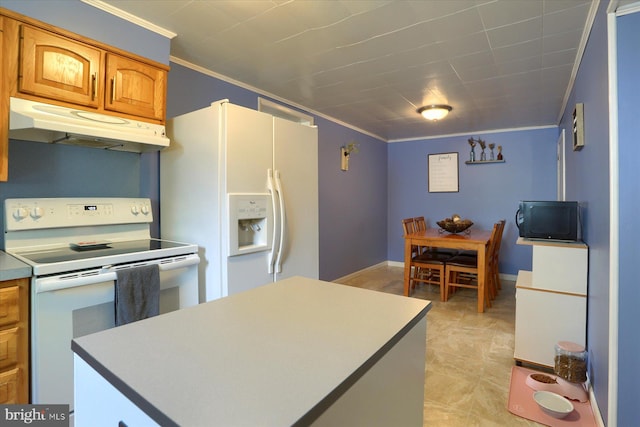 kitchen with ornamental molding, white appliances, a center island, under cabinet range hood, and brown cabinets
