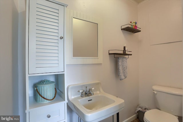 bathroom featuring toilet and a sink