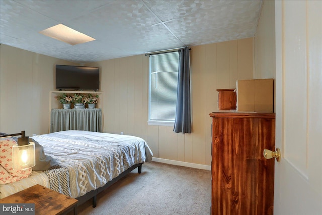 bedroom featuring carpet floors and baseboards