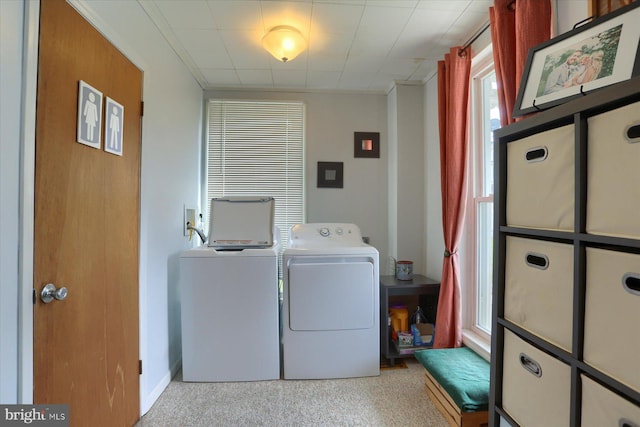 washroom with independent washer and dryer, laundry area, and carpet