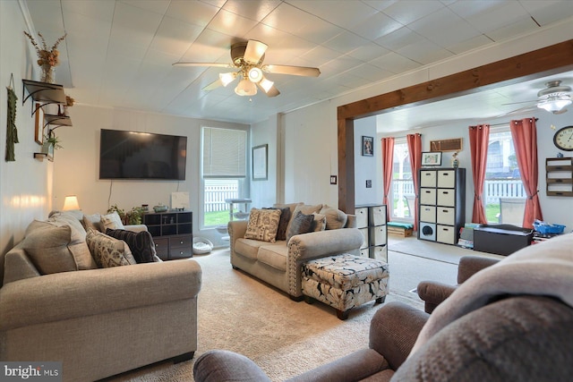 carpeted living room featuring ceiling fan