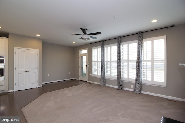 unfurnished living room with recessed lighting, a ceiling fan, and baseboards